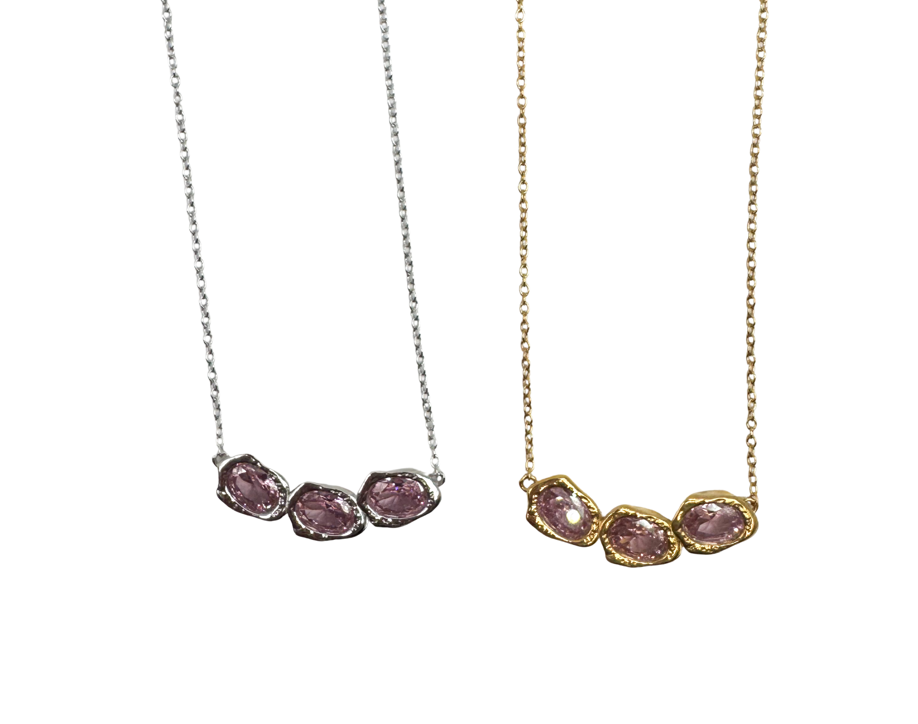 Lava Glacier pink necklace in 925 recycled silver with rhodium plating and pink cubic zirconia pendant, worn around a woman's neck, close-up portrait shot
